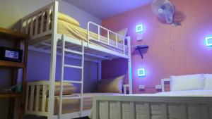 Ein Bett oder Betten in einem Zimmer der Unterkunft Thapae Gate Lodge
