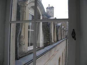 a view from a window of a building at Le jardin des chanceliers in Beaune