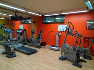a gym with many cardio equipment in a room at Apartment 4 Residence Palace 2 in Sestriere