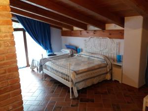 Säng eller sängar i ett rum på Agriturismo Fior Di Campo