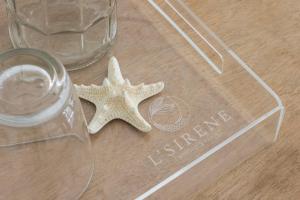 a starfish sitting on a table next to a glass at L'Sirene Boutique Resort in Baler