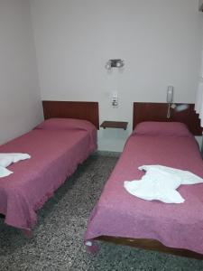 A bed or beds in a room at Hotel Mirasol