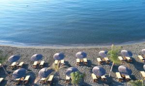 an overhead view of a beach with chairs and the ocean at Four Seasons Hotel in Limassol