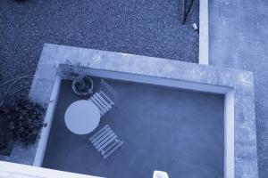 an overhead view of a patio with a table and stairs at Ananke B&B in Bisceglie