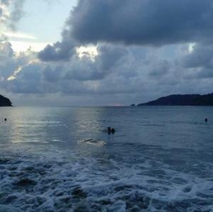 a group of people swimming in a large body of water at Casa Ixtapa in Ixtapa