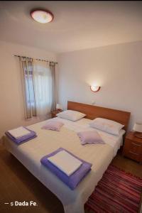 Ein Bett oder Betten in einem Zimmer der Unterkunft Apartments Punta
