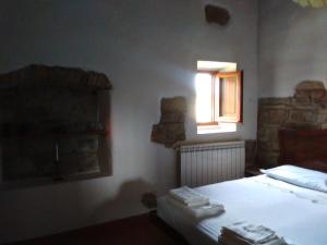 a bedroom with a bed and a window at Country house near Florence in Florence