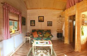 a living room with a couch and a table at Haus Alwine in Borkheide