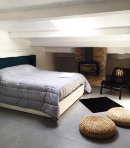 a bedroom with a large bed and a fireplace at B&B Sandro Pertini in Acri