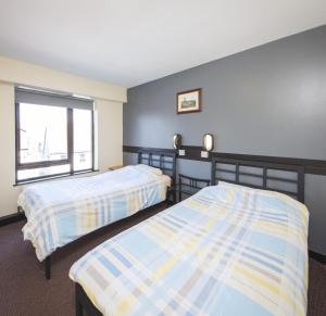Säng eller sängar i ett rum på Belfast International Youth Hostel