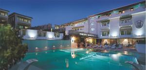 a large swimming pool in front of a hotel at Hotel Europa Monetti in Cattolica