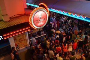 a crowd of people standing in front of a bar at Old Town Spot Apartment - Top Location & Albufeira in Albufeira