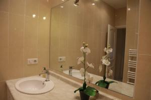 a bathroom with a sink and a mirror at Plage du Midi in Cannes +43 photos