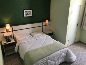 Cama ou camas em um quarto em Residencial Pantanal Santa Cruz