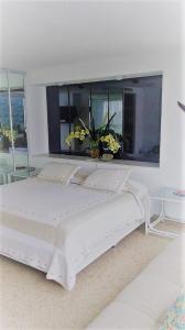 Cama o camas de una habitación en Torre Blanca Diamante Acapulco