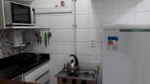 Η κουζίνα ή μικρή κουζίνα στο Flat Manu Copacabana