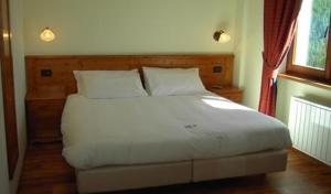Krevet ili kreveti u jedinici u objektu Crè Fornè Hotel & Spa