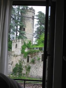 a view of a castle from a window at Il Sorriso in Orvinio