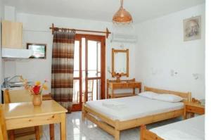 Postel nebo postele na pokoji v ubytování Mavroforos Hotel