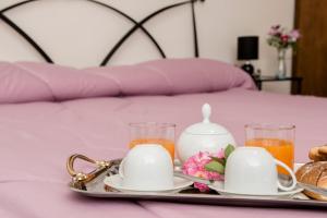 Postel nebo postele na pokoji v ubytování B&B Le Cinque Querce