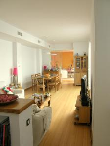 a living room with a couch and a dining room at B&B Casa Alfareria 59 in Seville