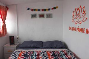 Postel nebo postele na pokoji v ubytování Hostal La Isla