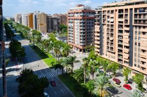 an aerial view of a city with palm trees and buildings at ApartUP Francia Views in Valencia