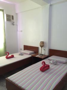 Postel nebo postele na pokoji v ubytování Brielles Travellers Inn