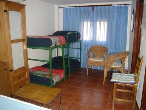 Cama o camas de una habitación en Hotel Mesón del Gallo