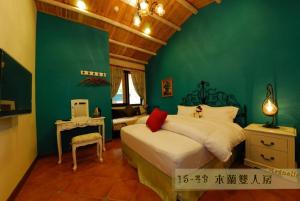 Katil atau katil-katil dalam bilik di Hsitou Man Tuo Xiang Homestay