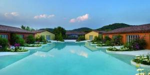 a painting of a swimming pool in a house at Joia Hotel & Luxury Apartments RTA in Brusaporto