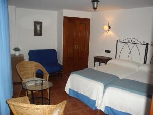 Cama o camas de una habitación en Hotel Mesón del Gallo