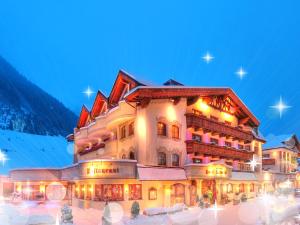 a ski resort with a lot of people in it at Salnerhof Superior Lifestyle Resort in Ischgl