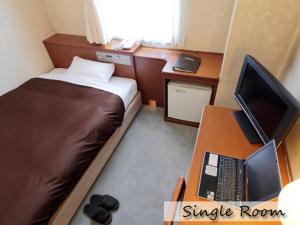 TV a/nebo společenská místnost v ubytování Utazu Grand Hotel