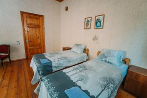 Postel nebo postele na pokoji v ubytování Bolnisi Prime House