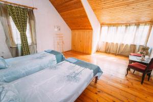 Postel nebo postele na pokoji v ubytování Bolnisi Prime House