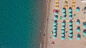 an overhead view of a beach with a bunch of boats at Hotel Parco Smeraldo Terme in Ischia