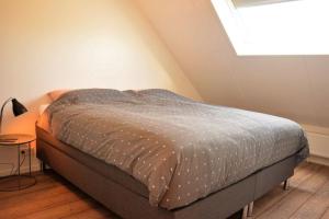 Postel nebo postele na pokoji v ubytování Hello Zeeland - Vakantiehuis Duinenburg 22A