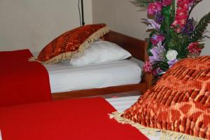 Postel nebo postele na pokoji v ubytování Pacific Paradise Motel