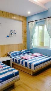 Llit o llits en una habitació de Fei Ying Homestay