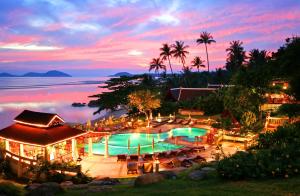 a view of the pool at the resort at sunset at Banburee Resort & All Spa Inclusive in Laem Set Beach