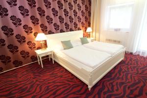 Posteľ alebo postele v izbe v ubytovaní Hotel Galant Lednice
