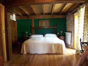 A bed or beds in a room at La Casa de Hijas