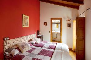A bed or beds in a room at La Casa de Hijas