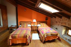 A bed or beds in a room at La Casa de Hijas