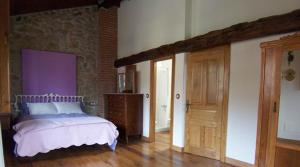 A bed or beds in a room at La Casa de Hijas