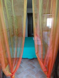 a group of curtains in a living room at Bed and Breakfast Ichnos in Cala Gonone