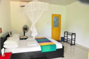 Postel nebo postele na pokoji v ubytování Sigiriya Amenity Home Stay