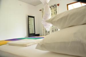 Postel nebo postele na pokoji v ubytování Sigiriya Amenity Home Stay