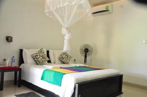 Postel nebo postele na pokoji v ubytování Sigiriya Amenity Home Stay